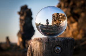 Editorial plan change of perspective stone form through glass sphere